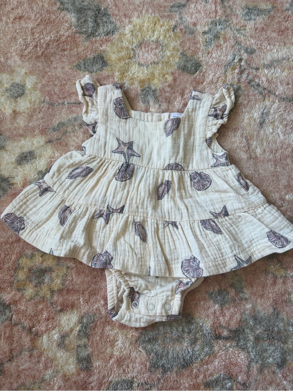 Infant Cream Ruffled Sunsuit with Seashell Print
